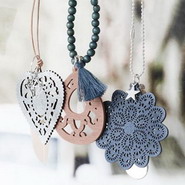 Trendy fall look with trendy necklaces and wooden pendants